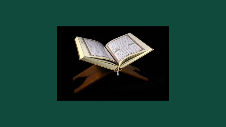 An open Quran resting on a wooden rehal, or book stand