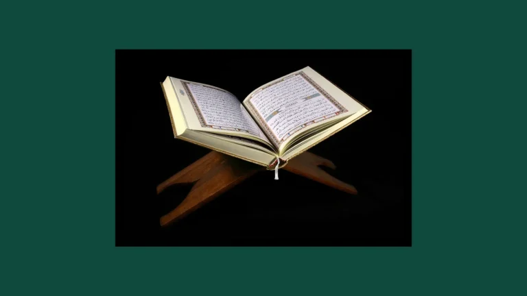 An open Quran resting on a wooden rehal, or book stand